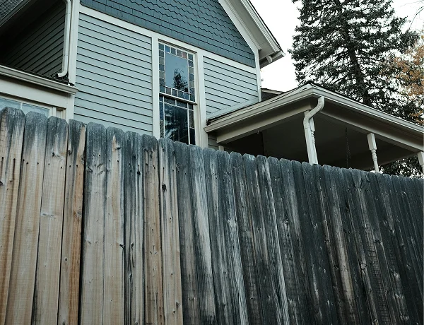 Old weathered timber fence due for replacement