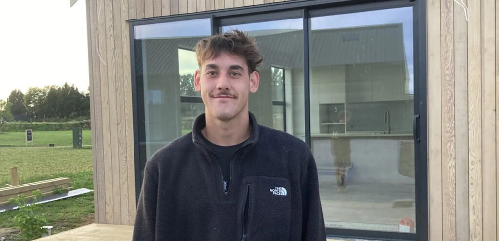 Kyle Devereux, apprentice builder at TK Homes, outside a new home build